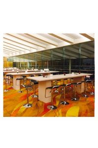 A large conference room with Replica Lem Barstools.