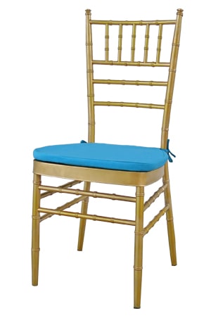 A gold Tiffany Chair with blue cushion.