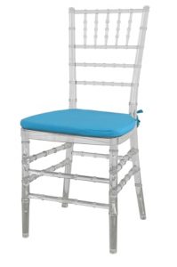 a clear tiffany chair transparent with blue cushion