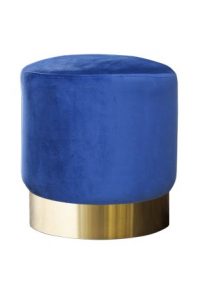 A Hudson Round Pouf on a gold base.