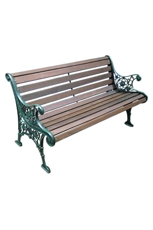 a vintage bench with an ornate frame on a white background