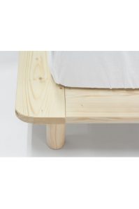 a coroman super single bed platform with a white sheet on top
