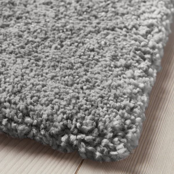 a rug medium grey on a wooden floor