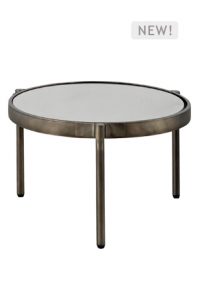 a soleil outdoor round coffee table with metal legs and a glass top
