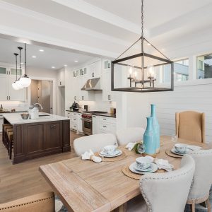 a kitchen with a home staging and chairs
