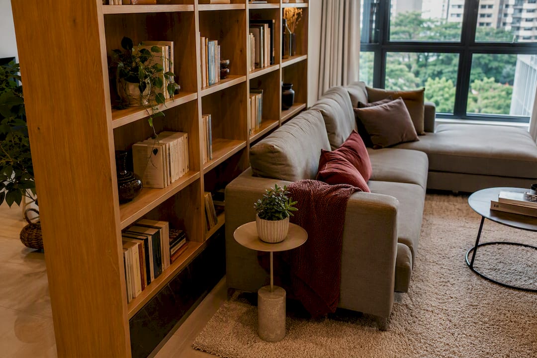 Bookcase creating privacy in open-plan living room