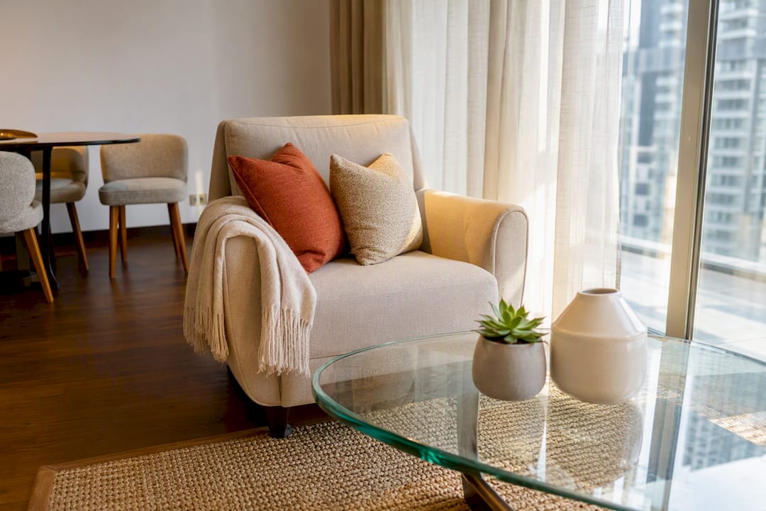 Staged living room corner with sofa and decor