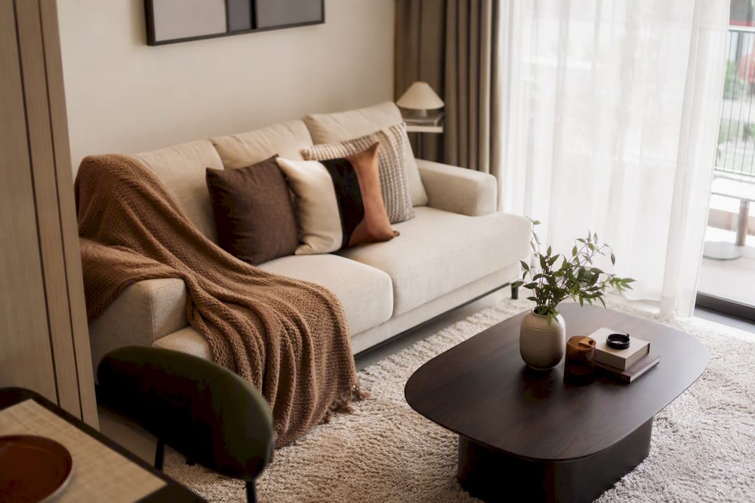 Warm, staged Singapore condo living room for temporary housing