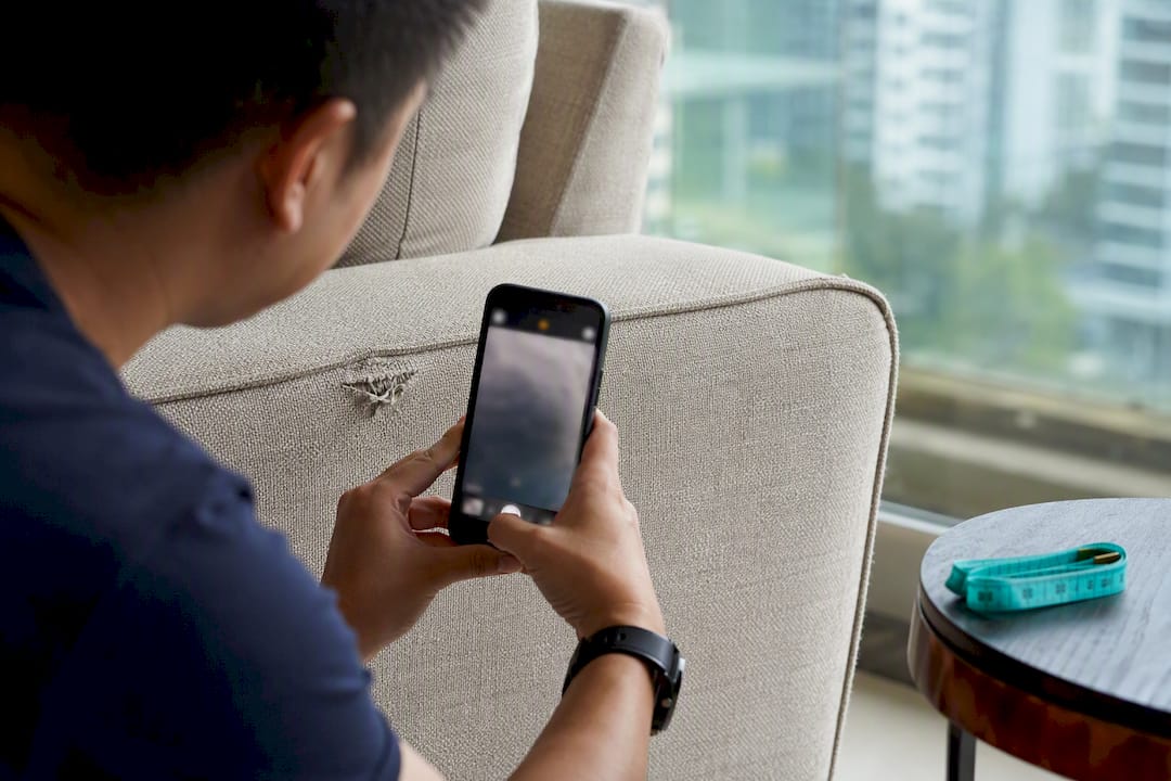 Tenant photographing existing furniture wear